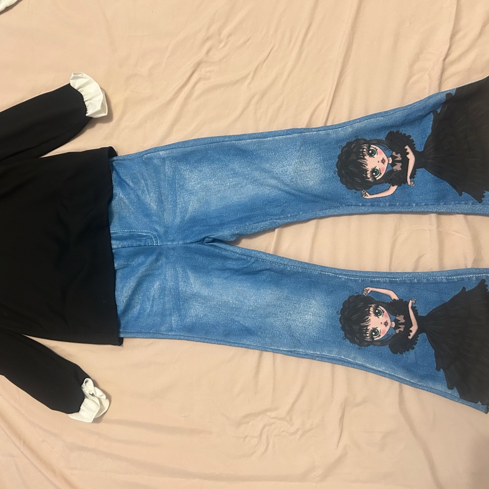 Wednesday Adam’s 2 piece shirt and pants set with matching dress.
